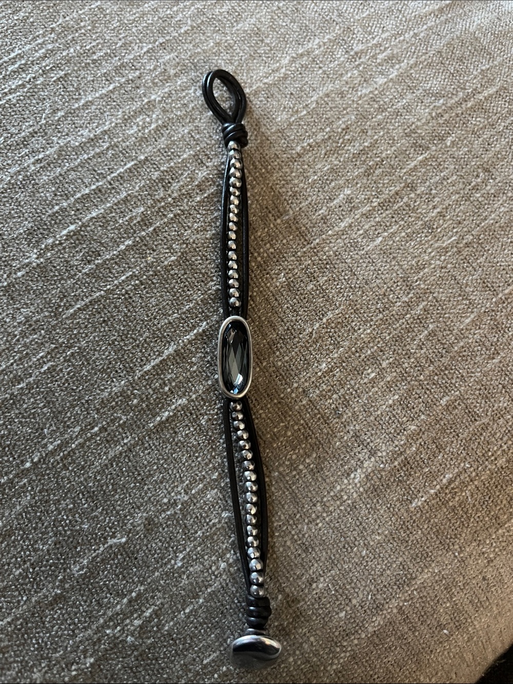 UNOde50 leather bracelet with blue gray crystal stone.